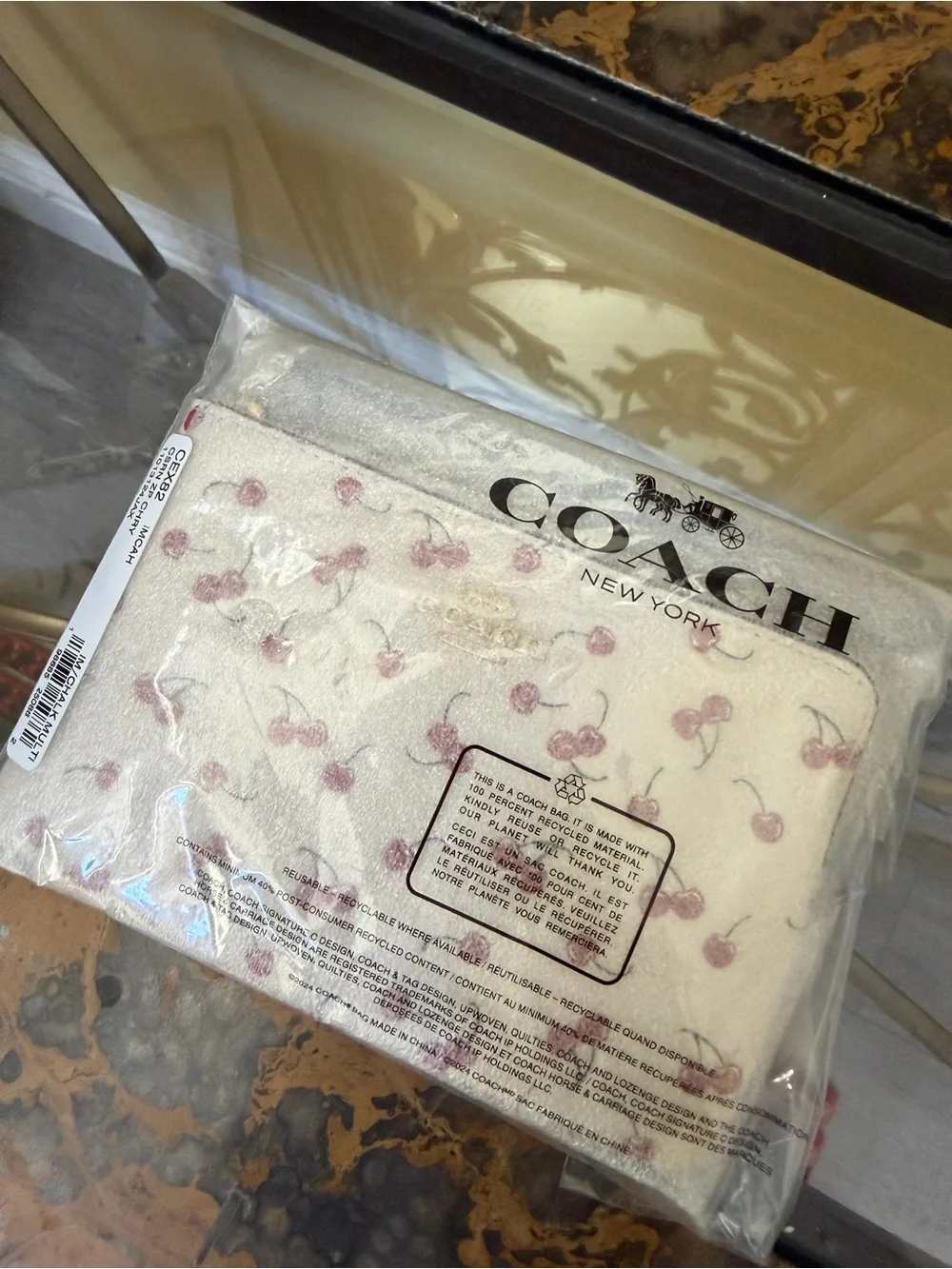 Coach Cream Wristlet with Red Cherry Print and Gold Logo